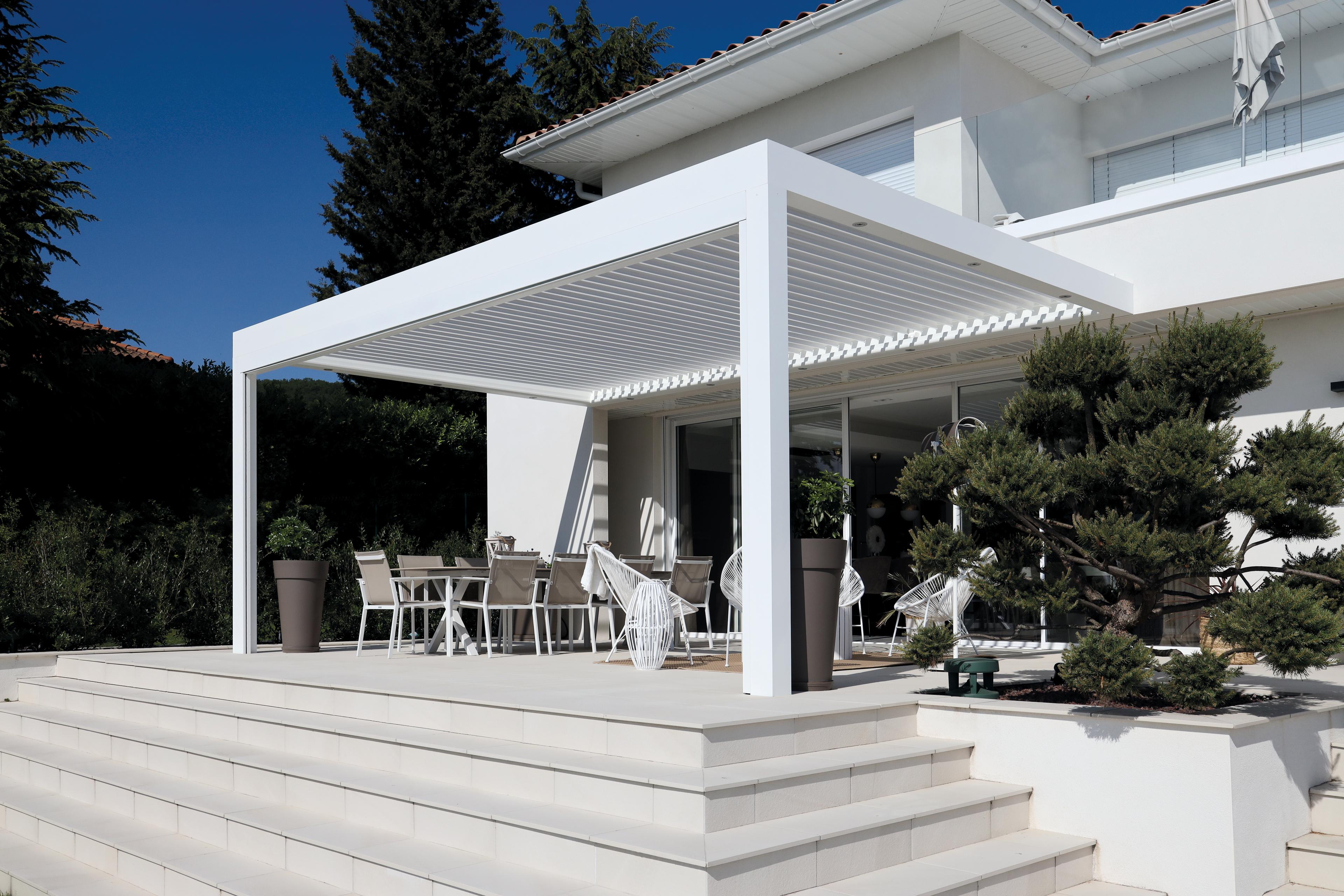 Biossun bioclimatic pergola, white, bottom view with contemporary home furnishings 